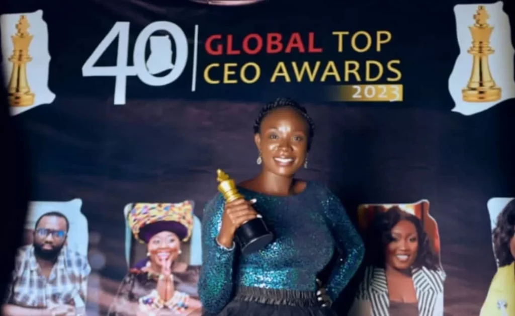 Ms. Nana Akua Akuffo displaying her Award at the ceremony
