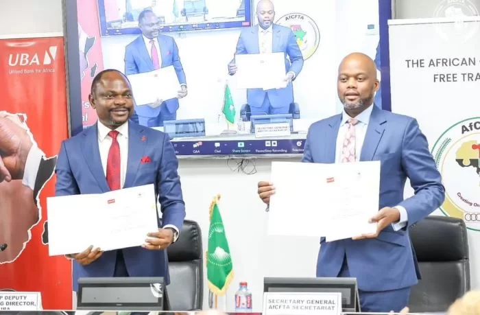UBA partners AfCFTA, invest $6bn to finance Small and Medium-scale Enterprises in Africa UBA Group DMD Muyiwa Akinyemi and Secretary-General of the AfCFTA Secretariat, H.E. Wamkele Mene showing the signed MoU