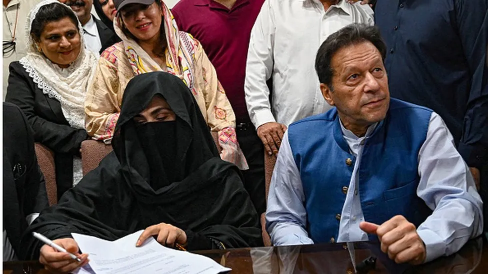 Former Pakistan PM and his wife jailed 14 years for corruption Imran Khan and his wife Bushra Bibi as seen last July posting bail